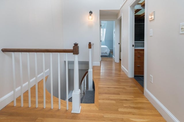 hall with light hardwood / wood-style flooring