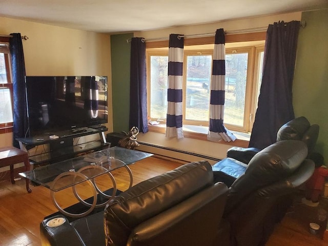 living room featuring hardwood / wood-style floors and a baseboard radiator