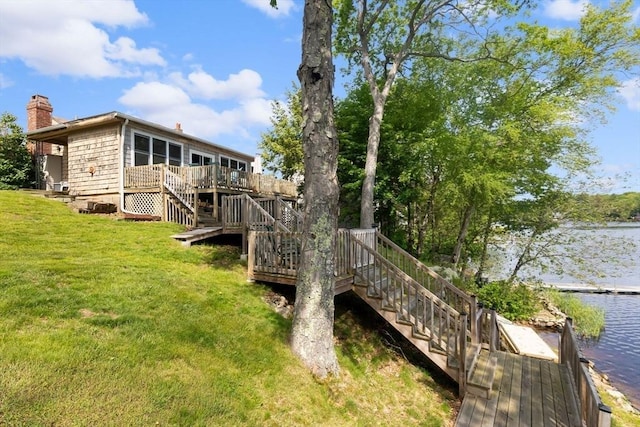 52 Lake Shore Dr, Essex, MA 01929 - back of house with stairway, a chimney, a lawn, and a deck with water view