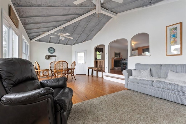 52 Lake Shore Dr, Essex, MA 01929 - living room with a ceiling fan, arched walkways, wood finished floors, beam ceiling, and high vaulted ceiling