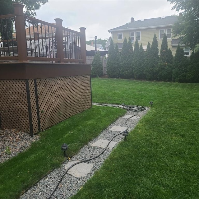 view of yard with a wooden deck