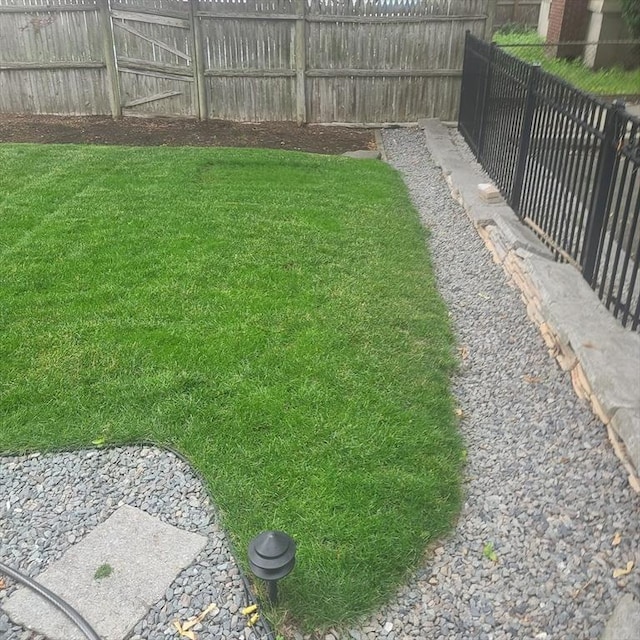 view of yard featuring a fenced backyard