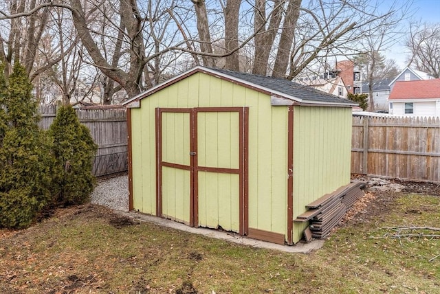 view of shed featuring a fenced backyard