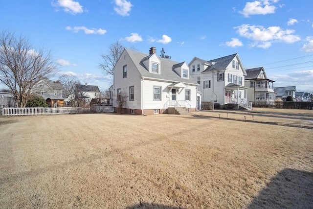 view of front of property with a front lawn