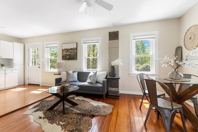 1 Batchelder Ave, North Reading, MA 01864 - living area with healthy amount of natural light, light wood-style floors, and baseboards
