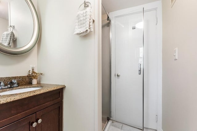1 Batchelder Ave, North Reading, MA 01864 - full bathroom featuring a stall shower, vanity, and tile patterned flooring