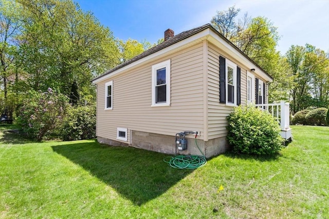 1 Batchelder Ave, North Reading, MA 01864 - view of home's exterior with a chimney and a yard