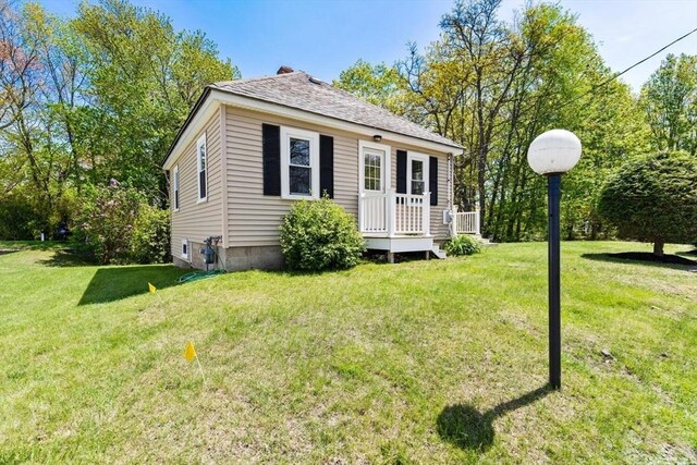 1 Batchelder Ave, North Reading, MA 01864 - view of front facade featuring a front lawn and roof with shingles