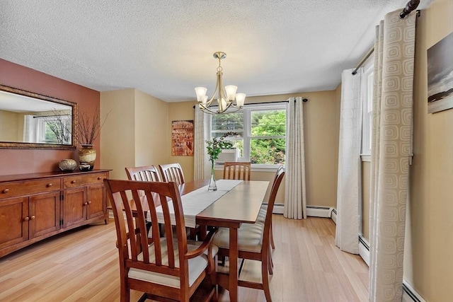 81 Baldwin Rd, Billerica, MA 01821 - dining room featuring light wood finished floors, a chandelier, baseboard heating, and a textured ceiling