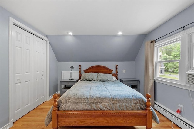 81 Baldwin Rd, Billerica, MA 01821 - bedroom featuring a baseboard radiator, lofted ceiling, light wood-style floors, and a closet