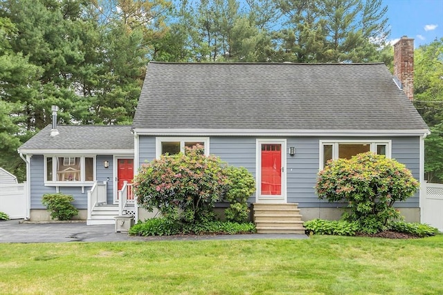 81 Baldwin Rd, Billerica, MA 01821 - new england style home with entry steps, a front lawn, a shingled roof, and a chimney