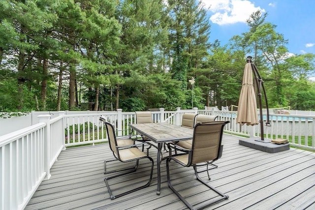 81 Baldwin Rd, Billerica, MA 01821 - deck with outdoor dining space, an outdoor pool, and view of scattered trees