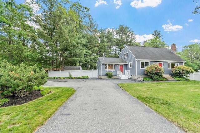 81 Baldwin Rd, Billerica, MA 01821 - view of front of property with a chimney and asphalt driveway