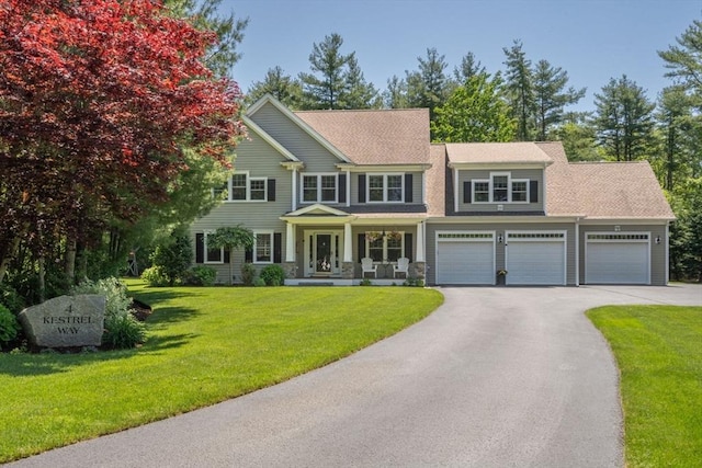 4 Kestrel Way, Carver, MA 02330 - view of front of property featuring asphalt driveway, a front lawn, and covered porch