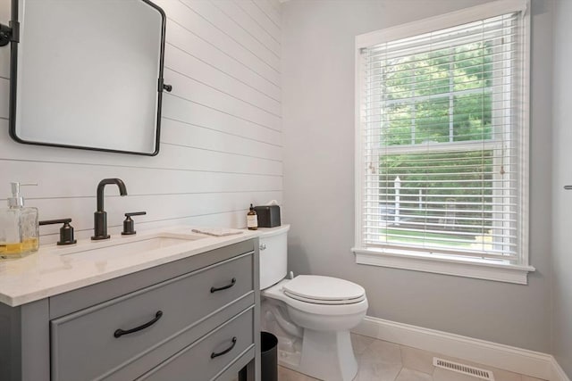 4 Kestrel Way, Carver, MA 02330 - half bath featuring baseboards, vanity, toilet, wood walls, and tile patterned flooring