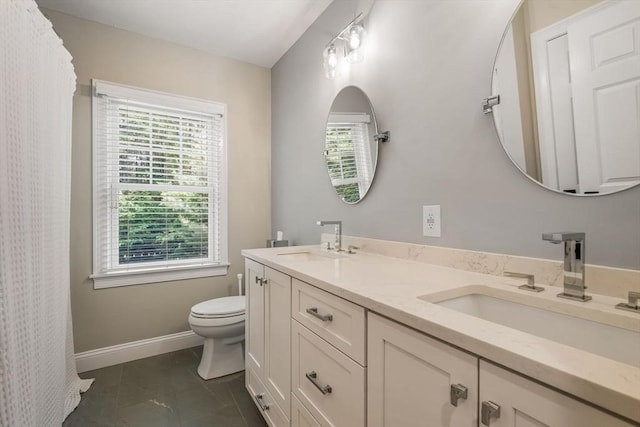 4 Kestrel Way, Carver, MA 02330 - bathroom featuring toilet, double vanity, tile patterned floors, and baseboards