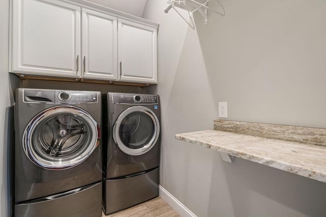 4 Kestrel Way, Carver, MA 02330 - washroom with cabinet space, washing machine and clothes dryer, and baseboards
