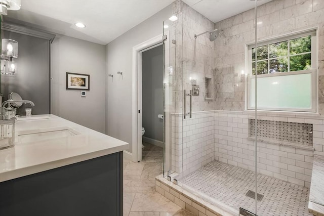 4 Kestrel Way, Carver, MA 02330 - bathroom with a shower stall, toilet, double vanity, marble look tiles, and recessed lighting