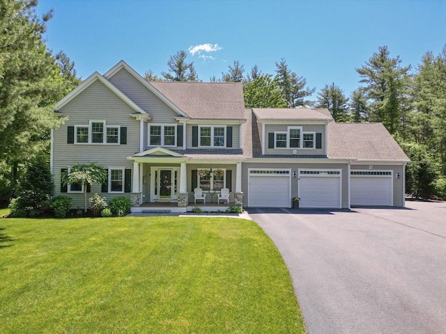 4 Kestrel Way, Carver, MA 02330 - view of front facade with asphalt driveway, a porch, a front yard, and roof with shingles