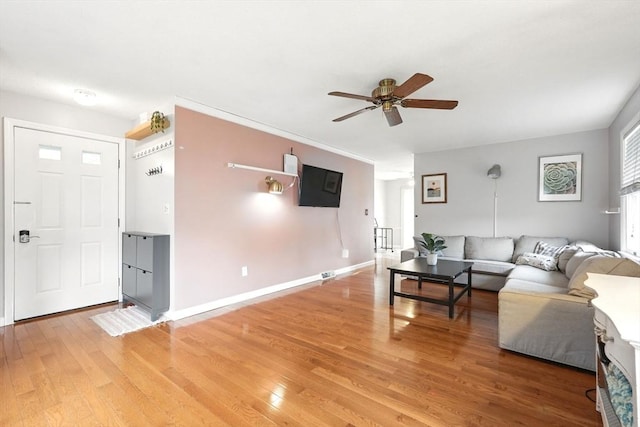 19 Arnold Ave, Chicopee, MA 01013 - living room featuring ceiling fan, light wood-style flooring, and baseboards