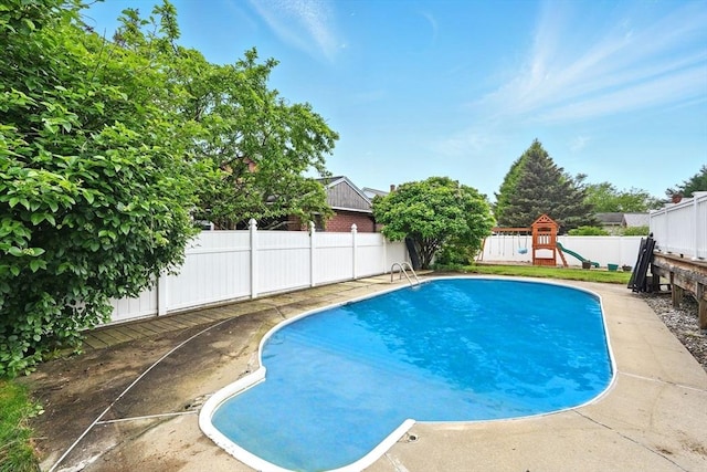 19 Arnold Ave, Chicopee, MA 01013 - view of swimming pool with a fenced backyard and a playground