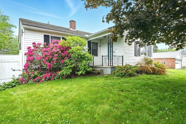 19 Arnold Ave, Chicopee, MA 01013 - rear view of property featuring a chimney and covered porch