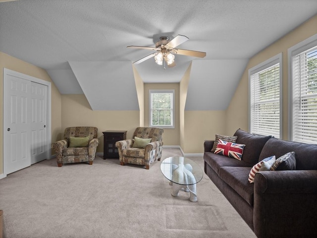 66 Saville, North Andover, MA 01845 - carpeted living area with healthy amount of natural light, ceiling fan, vaulted ceiling, baseboards, and a textured ceiling