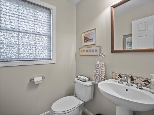 66 Saville, North Andover, MA 01845 - bathroom featuring a sink, toilet, and baseboards