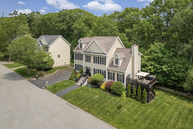66 Saville, North Andover, MA 01845 - view of front facade with a chimney, a front lawn, and roof with shingles