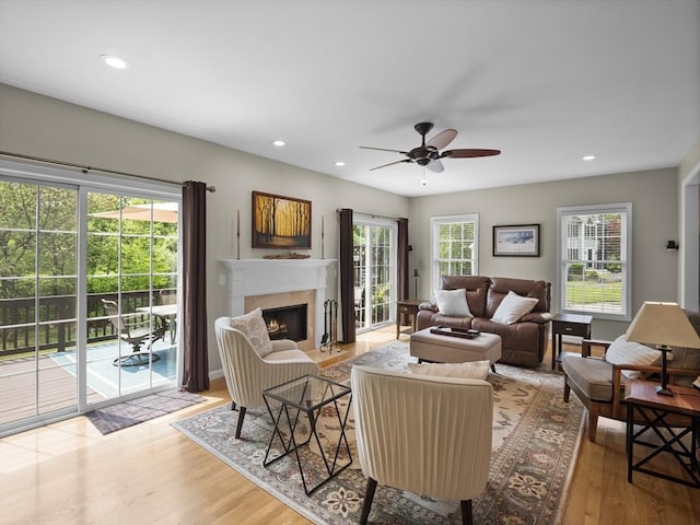 66 Saville, North Andover, MA 01845 - living room featuring a fireplace with flush hearth, a ceiling fan, wood finished floors, and recessed lighting