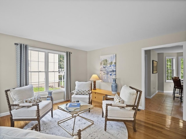 66 Saville, North Andover, MA 01845 - living area with healthy amount of natural light, baseboards, and wood finished floors