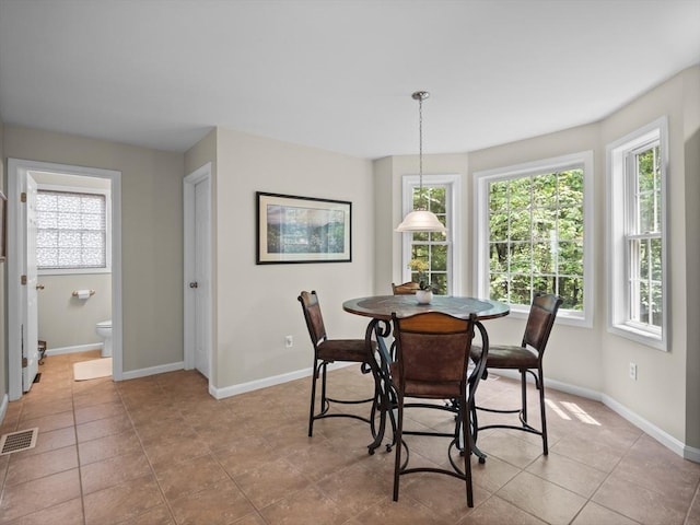 66 Saville, North Andover, MA 01845 - dining room with healthy amount of natural light, baseboards, and light tile patterned floors