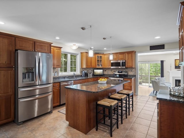 66 Saville, North Andover, MA 01845 - kitchen featuring stainless steel appliances, healthy amount of natural light, a sink, a breakfast bar, and recessed lighting