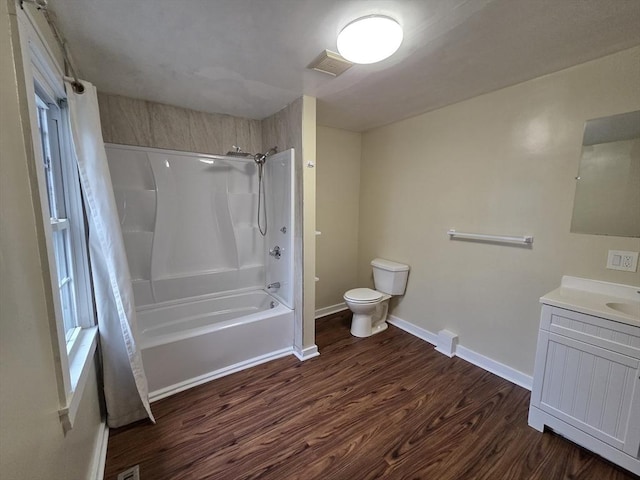 full bathroom featuring visible vents, wood finished floors, toilet, baseboards, and shower / bathtub combination with curtain
