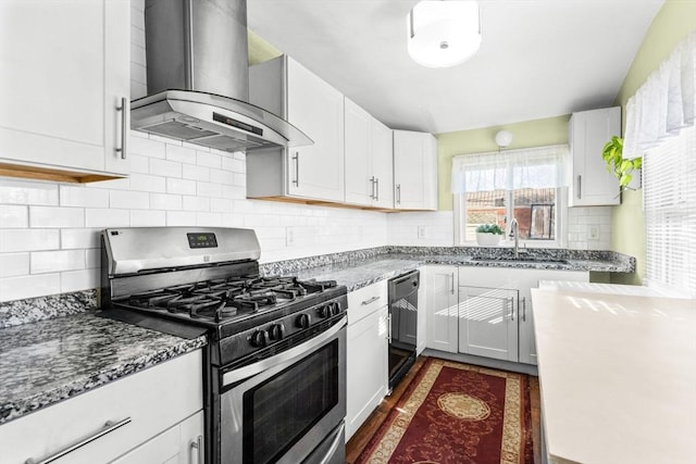 kitchen featuring gas stove, white cabinetry, sink, and extractor fan