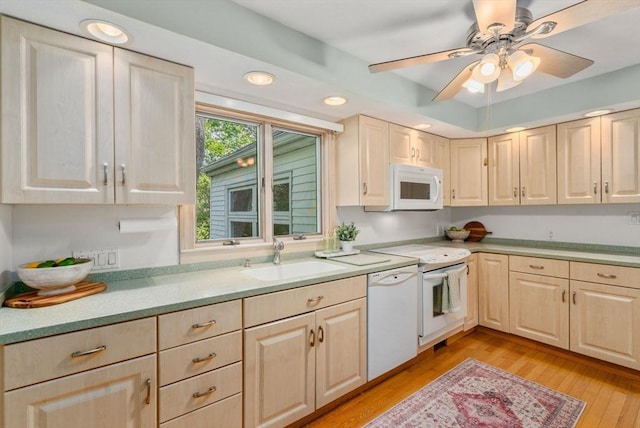 68 Shelton Rd, Swampscott, MA 01907 - kitchen with a sink, white appliances, light brown cabinets, light wood finished floors, and light countertops