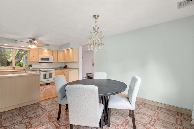68 Shelton Rd, Swampscott, MA 01907 - dining room with a chandelier, light flooring, and a ceiling fan