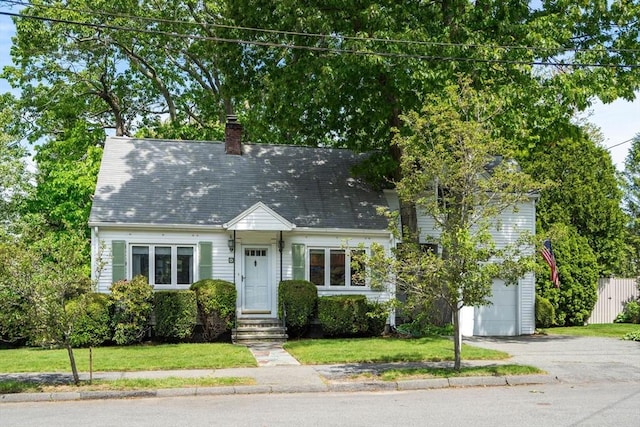 68 Shelton Rd, Swampscott, MA 01907 - cape cod-style house with asphalt driveway, an attached garage, a front lawn, and a chimney