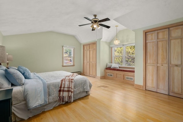 68 Shelton Rd, Swampscott, MA 01907 - bedroom featuring two closets, light wood-style flooring, vaulted ceiling, and ceiling fan