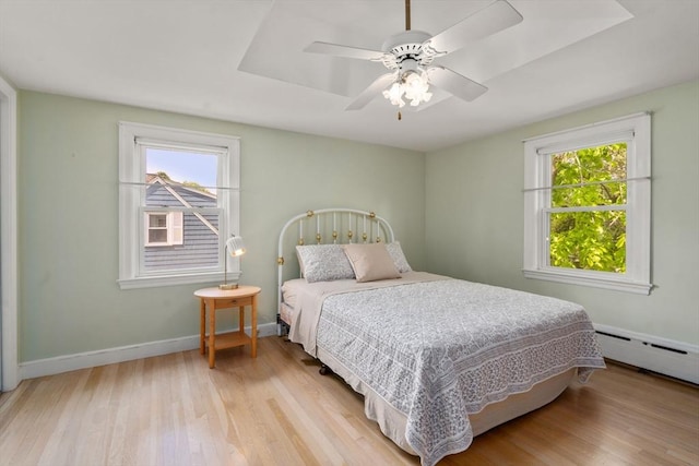 68 Shelton Rd, Swampscott, MA 01907 - bedroom featuring multiple windows, light wood finished floors, and baseboards