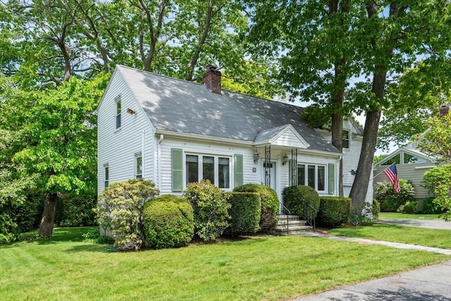 68 Shelton Rd, Swampscott, MA 01907 - new england style home with a chimney, a front yard, and a shingled roof
