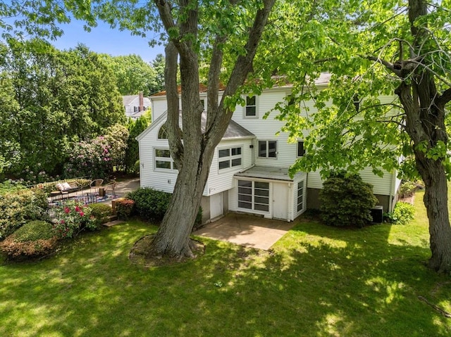68 Shelton Rd, Swampscott, MA 01907 - rear view of house featuring a lawn and a patio area