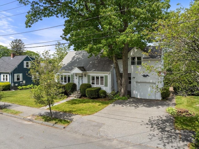 68 Shelton Rd, Swampscott, MA 01907 - cape cod home with concrete driveway, a front yard, and an attached garage