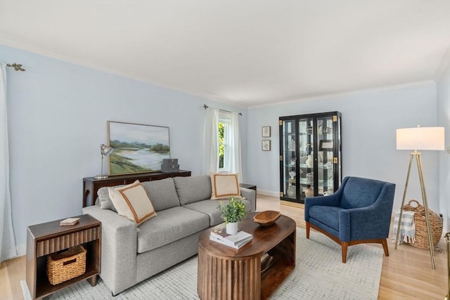 68 Shelton Rd, Swampscott, MA 01907 - living room with light wood-type flooring, crown molding, and baseboards
