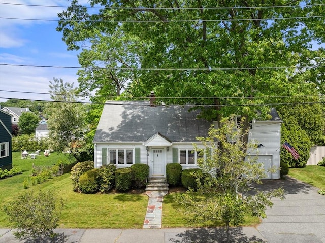 68 Shelton Rd, Swampscott, MA 01907 - new england style home with driveway, a front yard, a chimney, and an attached garage