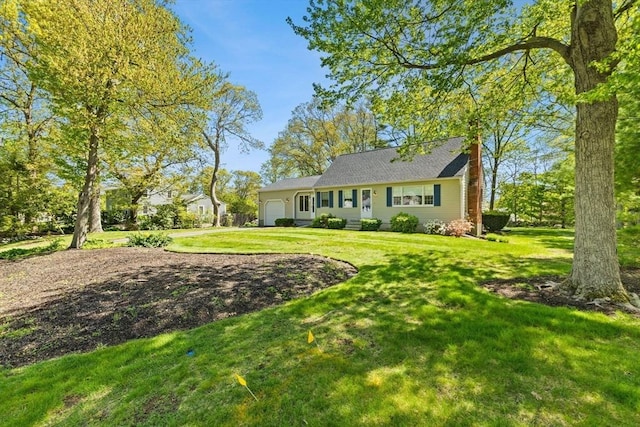 view of front of home with a garage, dirt driveway, and a front lawn