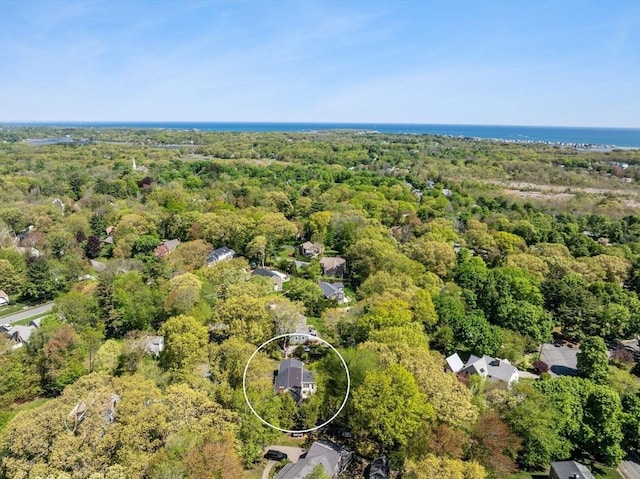 aerial view of property's location with a forest