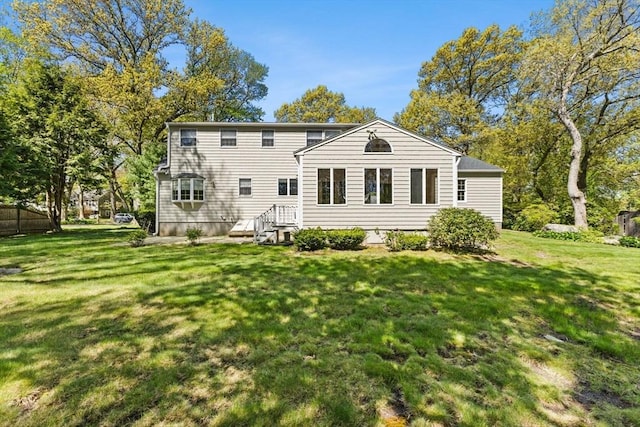 back of house with a yard