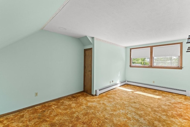 additional living space featuring carpet flooring, vaulted ceiling, a baseboard radiator, and baseboards