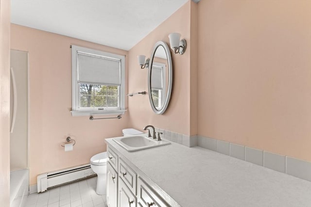 full bath featuring a baseboard radiator, toilet, tile patterned flooring, vanity, and baseboards
